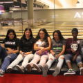 Students on a bowling alley bench
